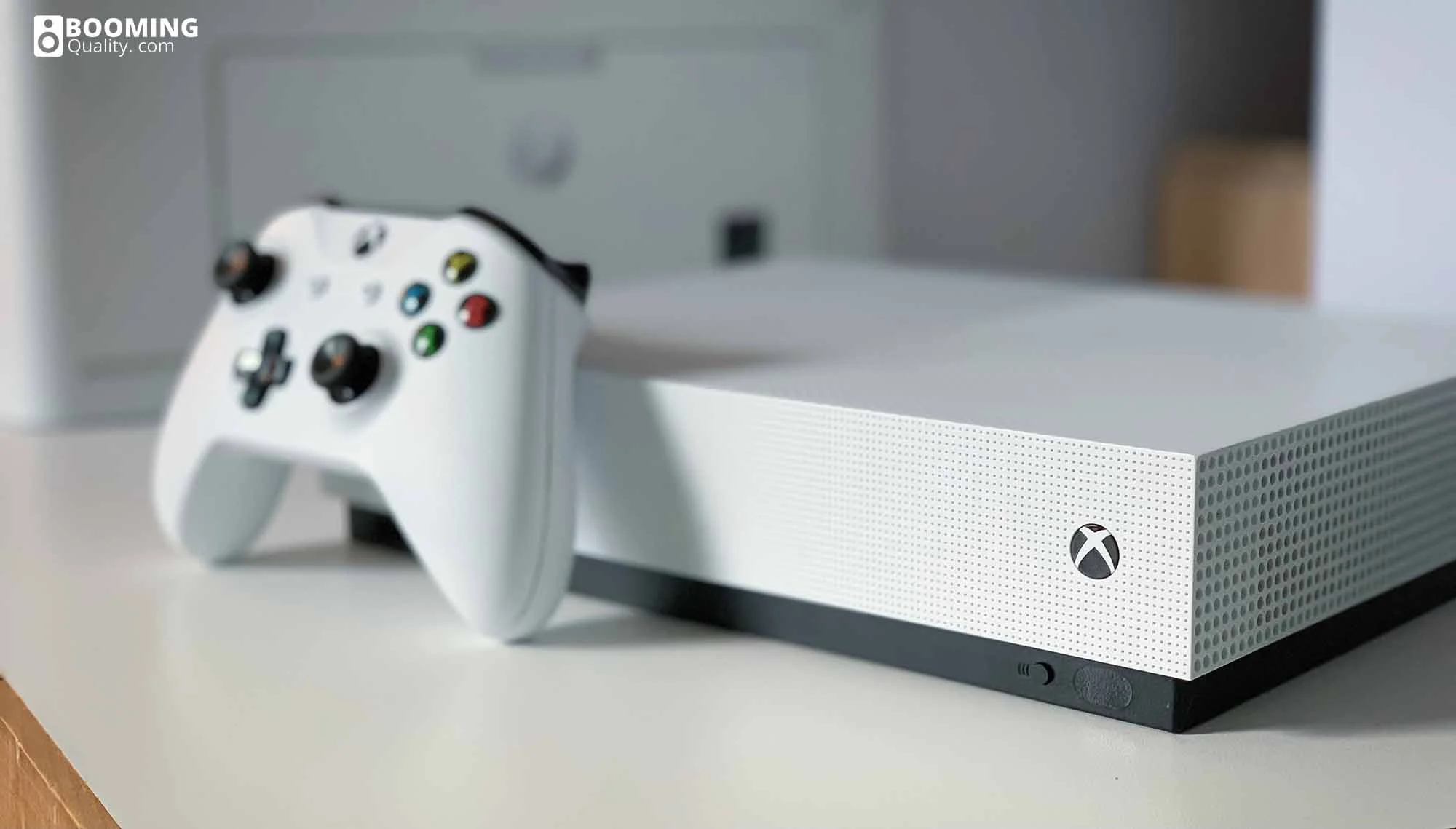 an Xbox One in white with controller