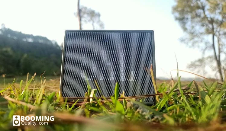 Best soundbars for outdoors. JBL speaker in the grass