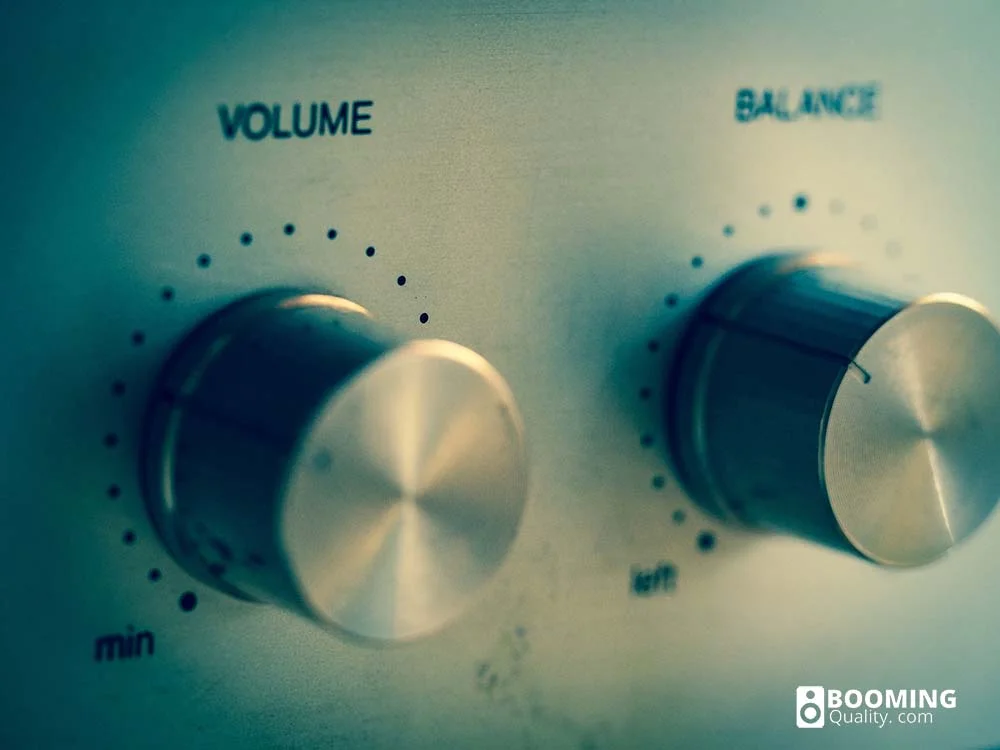 Volume and balance dials on a silver speaker.